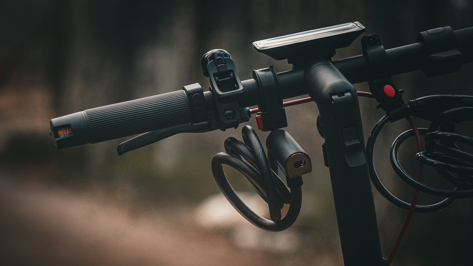 A close up of the steering rack of an electric scooter